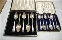 Lot 499 - A cased set of five silver grapefruit spoons;...