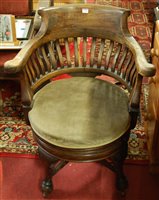 Lot 1399 - An early 20th century walnut slatback tub...