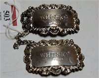 Lot 503 - A near-pair of silver decanter collars, each...