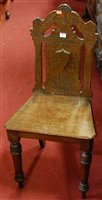 Lot 1415 - A late Victorian oak panelled seat single hall...
