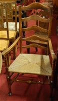 Lot 1416 - A late 19th century provincial elm ladderback...