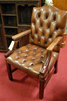 Lot 1429 - A contemporary brown leather buttoned...