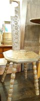 Lot 1442 - A relief carved oak spinning seat raised on...