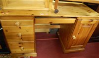 Lot 1449 - A modern pine kneehole desk, width 128cm