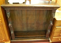 Lot 1454 - A circa 1900 heavily carved oak freestanding...