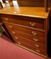 Lot 1473 - A contemporary Stag chest of five long drawers,...