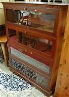 Lot 1481 - A contemporary walnut freestanding bookcase...