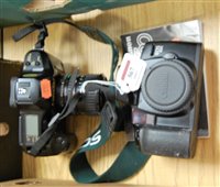 Lot 567 - A Canon T90 camera together with a Canon Edeos...