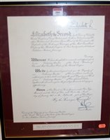 Lot 589 - A framed Order of the British Empire letter...