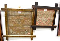 Lot 593 - A framed alphabetical sampler by Caroline...
