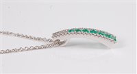 Lot 1216 - An 18ct emerald and diamond pendant, the...