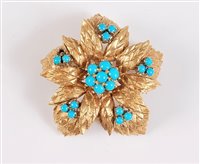Lot 1153 - An 18ct turquoise brooch, the central...