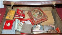Lot 655 - A leather suitcase containing a quantity of...