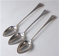 Lot 1134 - Three George III silver stuffing spoons,...