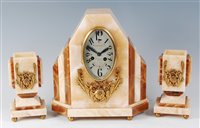 Lot 184 - A French Art Deco onyx and floral gilt metal...