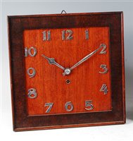 Lot 182 - An Art Deco oak hanging wall clock, of plain...