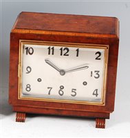 Lot 183 - An Art Deco figured walnut cased mantel clock,...