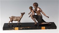 Lot 235 - A large French Art Deco patinated figure group...