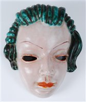 Lot 43 - A 1930s Goldscheider terracotta face mask, her...