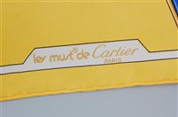 Lot 169 - A Must de Cartier of Paris silk scarf, having...