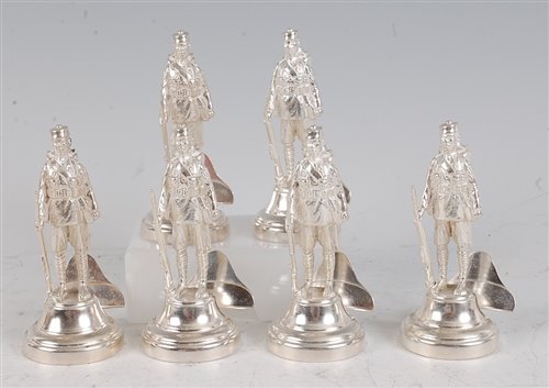 Lot 1145 - A set of six contemporary silver menu stands,...