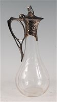 Lot 101 - A WMF Art Nouveau claret jug, having a shaped...