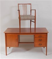 Lot 425 - A 1960s mahogany kneehole writing desk,...