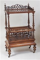 Lot 1622 - A Victorian figured walnut canterbury whatnot,...