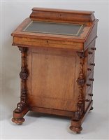 Lot 1623 - A Victorian figured walnut kneehole writing...