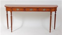 Lot 1624 - A satinwood three drawer hall table, in the...