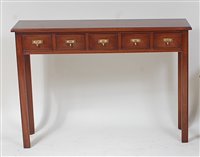 Lot 1617 - A mahogany five drawer spice table, raised on...