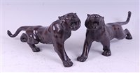 Lot 1319 - A pair of Japanese Meiji period bronze tigers,...
