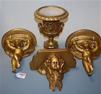 Lot 34 - A pair of gilt painted plaster wall brackets,...