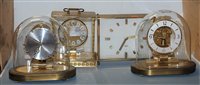 Lot 49 - A Kundo electronic brass cased mantel clock...