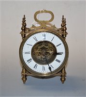 Lot 57 - An early 20th century brass cased mantel clock...