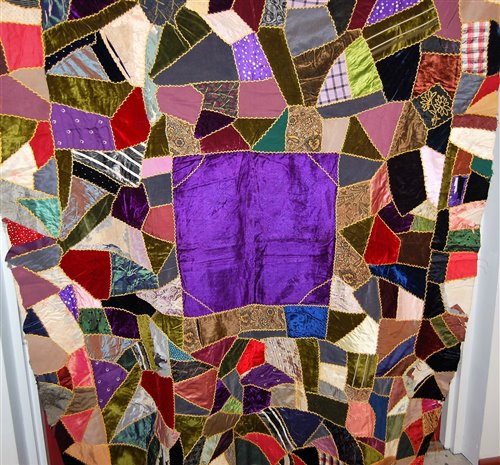 Lot 61 - An early 20th century patchwork table cloth...