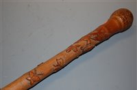 Lot 112 - A 19th century bamboo walking cane profusely...