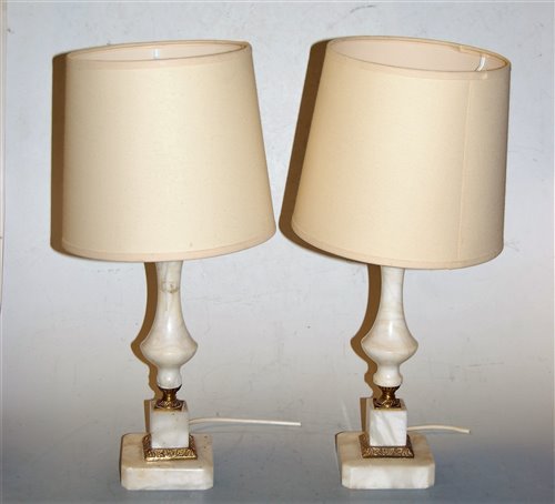 Lot 115 - A pair of onyx and brass mounted table lamps...