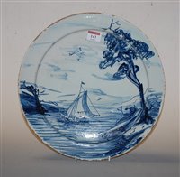 Lot 143 - An 18th century Liverpool Delft charger,...