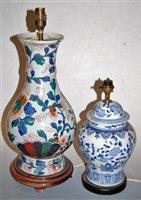 Lot 144 - A modern porcelain table lamp base of slender...