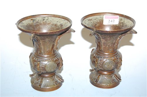 Lot 242 - A pair of Oriental bronze vases, each with...