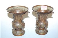 Lot 242 - A pair of Oriental bronze vases, each with...