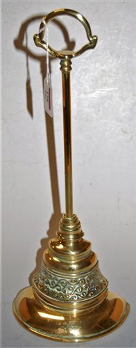 Lot 175 - A Victorian brass and cast iron door stop,...