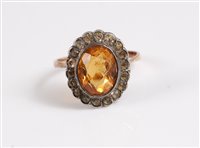Lot 331 - A citrine dress ring, the oval citrine collet...