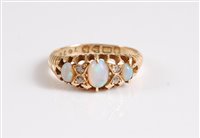 Lot 332 - An 18ct three stone opal ring, the three oval...