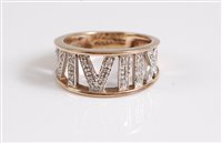 Lot 334 - A 9ct and diamond ring, the tapered half hoop...