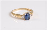 Lot 336 - An 18ct sapphire and diamond ring, the...