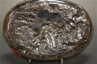 Lot 277 - A silver oval dish, the ground worked in...