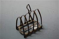 Lot 292 - A George V silver four division toast rack,...