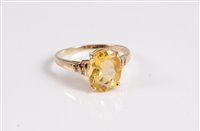 Lot 341 - A 9ct oval citrine ring set with small white...